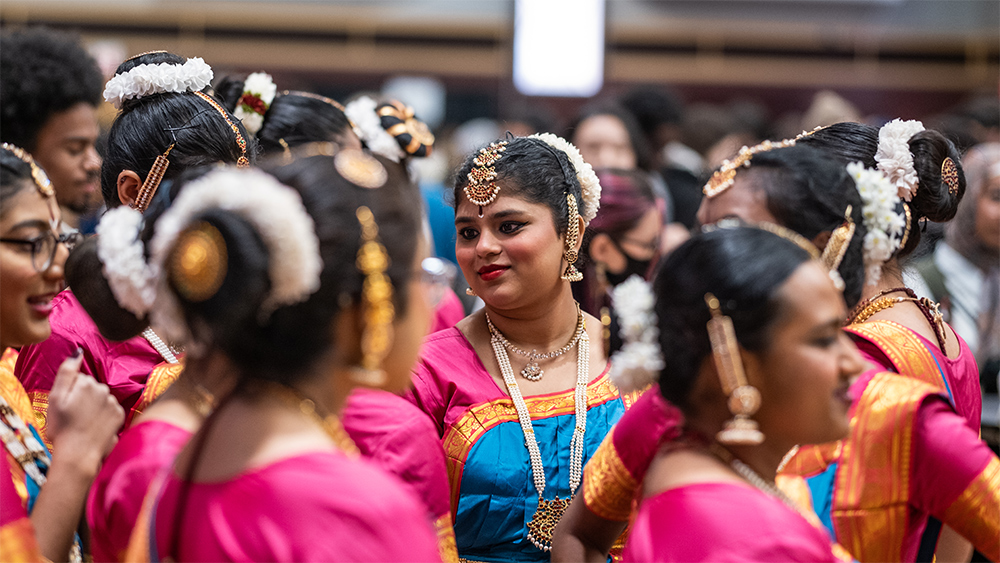 Taste of OSU hosted by the Office of International Affairs in the Archie Griffin Grand Ballroom at the Ohio Union. Student organizations cook international food, decorate a cultural booths and showcase cultural performances like dance and music. OSU Inaayat reacts to a performance on stage.